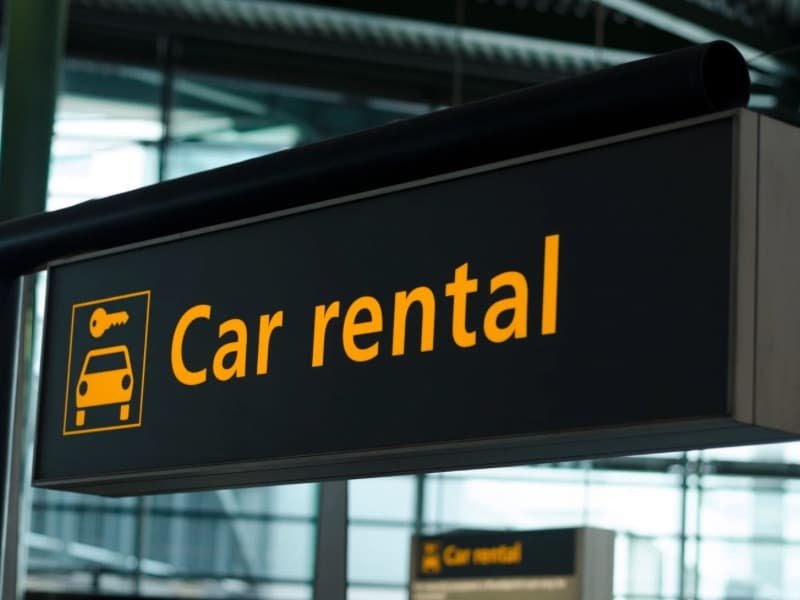Car rental sign post image