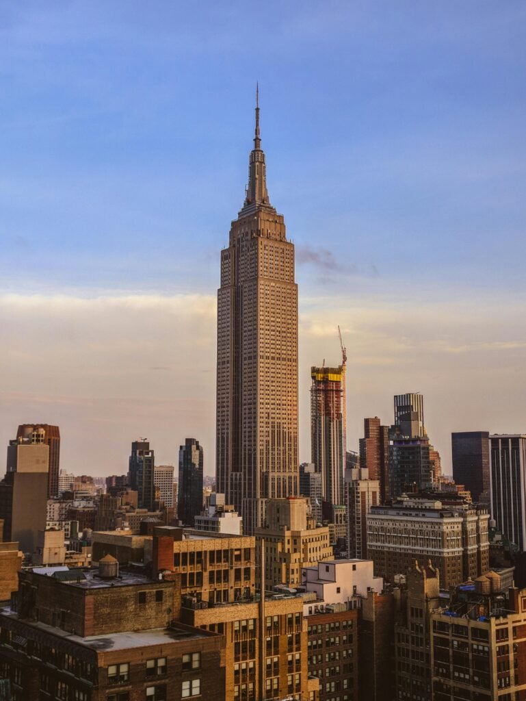 New York vs Tokyo: A Japan Traveler’s Thought on 2 Wonderful Cities 2 A stunning view of the Empire State Building amidst New York City's urban skyline at sunset.