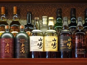 8 Best Factory Tours in Japan: Toyota, CupNoodles & More 7 bar, yamazaki, togouchi, japanese blended, liquor, bottles, alcohol, pub, whisky, martini, spirit, liquid, collection, nightclub, drink, nightlife, cocktail, party, beverage, brown party, brown bottle, yamazaki, yamazaki, yamazaki, yamazaki, yamazaki, whisky, nightclub